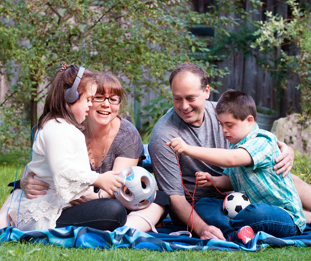 Mother, father and twins with autism and Down syndrome
