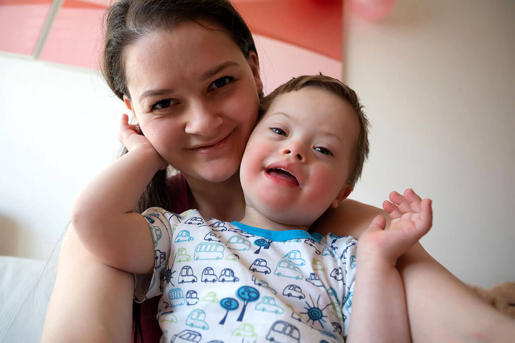 Mother with toddler with Down syndrome